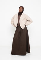 Veste en laine bouclée beige coupe ample. Boutique musulmane.