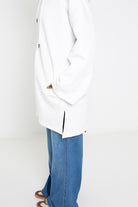 Veste longue coton pour femme musulmane. Détail fente.