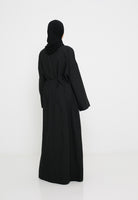 Robe longue vue de dos tombé fluide et élégant.