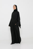 Robe longue classe noire avec plis et coupe structurée, coupe et manche ample pour femme musulmane.