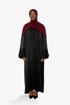 Robe ample à manche large avec bouton pour femme musulmane. Boutique hijab moderne.