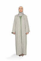 Abaya en tweed verte pour femme musulmane. Boutique hijab.