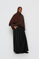 Longue jupe coupe évasée noir avec poche pour femme musulmane. Boutique hijab marque modeste fashion